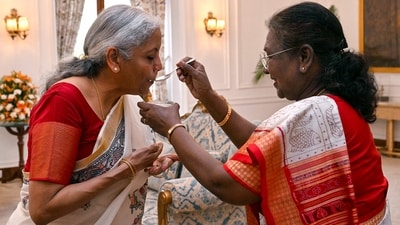 President Droupadi Murmu fed Union Finance Minister Nirmala Sitharaman the customary 'dahi-cheeni' (curd and sugar) before presenting the Union Budget 2025, at Rashtrapati Bhavan in New Delhi on Saturday. (ANI) President Droupadi Murmu fed Union Finance Minister Nirmala Sitharaman the customary 'dahi-cheeni' (curd and sugar) before presenting the Union Budget 2025, at Rashtrapati Bhavan in New Delhi on Saturday. (ANI)