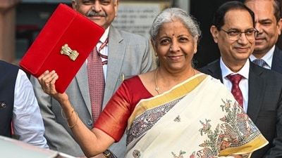 Union Finance Minister Nirmala Sitharaman leaves the Finance Ministry office along with other members to present the budget at the parliament in New Delhi. (Bloomberg) Union Finance Minister Nirmala Sitharaman leaves the Finance Ministry office along with other members to present the budget at the parliament in New Delhi. (Bloomberg)