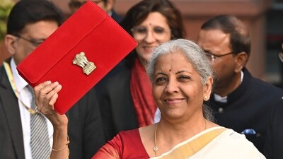Union Finance Minister Nirmala Sitharaman shows the Union Budget 2025 ahead of her presentation in the parliament. (Bloomberg) Union Finance Minister Nirmala Sitharaman shows the Union Budget 2025 ahead of her presentation in the parliament. (Bloomberg)