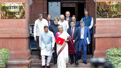 India's Finance Minister Nirmala Sitharaman holds a folder with the Government of India's logo while leaving her office to present the union budget in the parliament in New Delhi. (REUTERS)