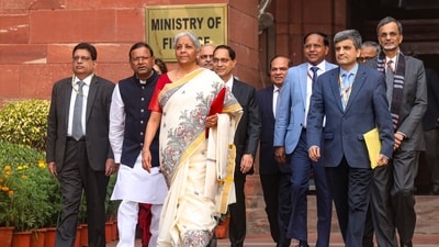 Union Finance Minister Nirmala Sitharaman with Union Minister of State for Finance Pankaj Chaudhary and other officials outside the Finance Ministry. (PTI) Union Finance Minister Nirmala Sitharaman with Union Minister of State for Finance Pankaj Chaudhary and other officials outside the Finance Ministry. (PTI)