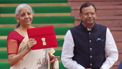 Nirmala Sitharaman with Union Minister of State for Finance Pankaj Chaudhary as she arrived at the Parliament House complex to present her eight Union Budget 2025-26. (PTI) Nirmala Sitharaman with Union Minister of State for Finance Pankaj Chaudhary as she arrived at the Parliament House complex to present her eight Union Budget 2025-26. (PTI)