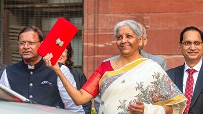 Union Finance Minister Nirmala Sitharaman with Union Minister of State for Finance Pankaj Chaudhary and other officials outside the Finance Ministry ahead of the presentation of the Union Budget 2025-26, in New Delhi, Saturday, Feb. 1, 2025. (PTI) Union Finance Minister Nirmala Sitharaman with Union Minister of State for Finance Pankaj Chaudhary and other officials outside the Finance Ministry ahead of the presentation of the Union Budget 2025-26, in New Delhi, Saturday, Feb. 1, 2025. (PTI)