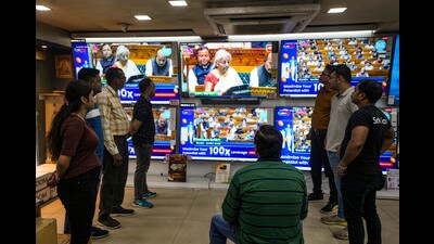 People watch a live telecast of the presentation of the ‘Union Budget 2025-26’ on televisions at a showroom, in Kolkata. (PTI) People watch a live telecast of the presentation of the ‘Union Budget 2025-26’ on televisions at a showroom, in Kolkata. (PTI)