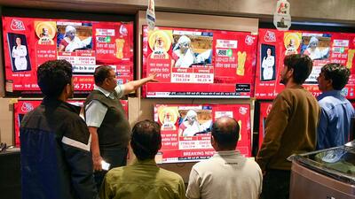 People watch the live telecast of Union Budget 2025 presented by Finance Minister Nirmala Sitharaman in the Lok Sabha of the Parliament, at a television showroom in Ranchi, India on Saturday. (ANI) People watch the live telecast of Union Budget 2025 presented by Finance Minister Nirmala Sitharaman in the Lok Sabha of the Parliament, at a television showroom in Ranchi, India on Saturday. (ANI)