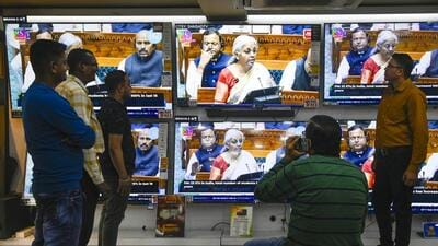 People watching the budget presentation by Union finance minister Nirmala Sitharaman at an Electronic shop in Kolkata on Saturday. (Samir Jana/ Hindustan Times) People watching the budget presentation by Union finance minister Nirmala Sitharaman at an Electronic shop in Kolkata on Saturday. (Samir Jana/ Hindustan Times)