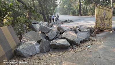 The dug-up spots have debris lying in the open, causing dust to billow as vehicles move past. The dug-up spots have debris lying in the open, causing dust to billow as vehicles move past.