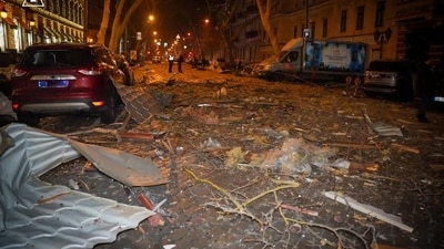 Debris is scattered across the road at the site of a Russian strike on Ukraine (via REUTERS)