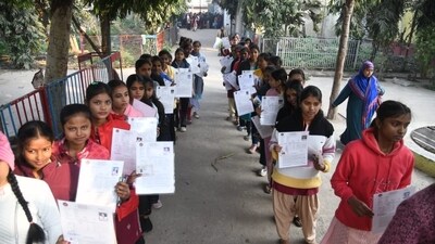 Students show their admit cards while they wait to check their documents to appear for BSEB Class 12 exam (Santosh Kumar) Students show their admit cards while they wait to check their documents to appear for BSEB Class 12 exam (Santosh Kumar)