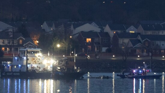 US Coast Guard crane arrives to remove the wreckage of a military Black Hawk helicopter on the Potomac River on January 31, 2025 in Arlington, Virginia. (Getty Images via AFP)