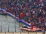Devotees gather to take a holy dip in the sacred waters of Sangam on the occasion of 'Mauni Amavasya' during the Maha Kumbh Mela festival, in Prayagraj on January 29, 2025.