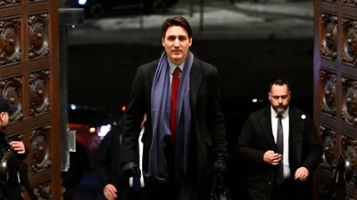 Canada's Prime Minister Justin Trudeau arrives to address media following the imposition of a raft of tariffs by U.S. President Donald Trump against Canada, Mexico and China, in Ottawa, Saturday, Feb. 1, 2025. (AP) Canada's Prime Minister Justin Trudeau arrives to address media following the imposition of a raft of tariffs by U.S. President Donald Trump against Canada, Mexico and China, in Ottawa, Saturday, Feb. 1, 2025. (AP)