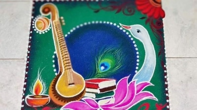 1. Veena Rangoli – Symbol of Goddess Saraswati: The Veena, Goddess Saraswati’s divine instrument, represents wisdom and art. Create a Veena-themed rangoli using yellow and white hues, adding intricate details to depict strings and floral embellishments. You can enhance it with diya placements for a divine glow. (Image by Instagram/Anamika's Rangavalli) 1. Veena Rangoli – Symbol of Goddess Saraswati: The Veena, Goddess Saraswati’s divine instrument, represents wisdom and art. Create a Veena-themed rangoli using yellow and white hues, adding intricate details to depict strings and floral embellishments. You can enhance it with diya placements for a divine glow. (Image by Instagram/Anamika's Rangavalli)