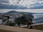 Tourists walk on the narrow streets of Fira town on the popular Aegean Sea holiday island of Santorini, southern Greece, Monday, Feb. 3, 2025, as emergency crews were deployed on the island after a spike in seismic activity raised concerns about a potentially powerful earthquake. Tourists walk on the narrow streets of Fira town on the popular Aegean Sea holiday island of Santorini, southern Greece, Monday, Feb. 3, 2025, as emergency crews were deployed on the island after a spike in seismic activity raised concerns about a potentially powerful earthquake.