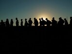 FILE - Migrants who crossed the Rio Grande and entered the U.S. from Mexico are lined up for processing by U.S. Customs and Border Protection, Sept. 23, 2023, in Eagle Pass, Texas. FILE - Migrants who crossed the Rio Grande and entered the U.S. from Mexico are lined up for processing by U.S. Customs and Border Protection, Sept. 23, 2023, in Eagle Pass, Texas.