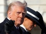 US President Donald Trump gestures beside U.S. first lady Melania Trump as they leave the U.S. Capitol building on the inauguration day.