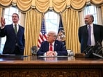 (L-R) US Secretary of Treasury Scott Bessent speaks as President Donald Trump and US Secretary of Commerce nominee Howard Lutnick look on after Trump signed an executive order to create a US sovereign wealth fund, in the Oval Office of the White House on February 3, 2025, in Washington, DC. (Photo by Jim WATSON / AFP)
