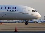 FILE PHOTO: A United Airlines' Boeing Co's 787 Dreamliner plane (front) taxis after landing following its flight from Los Angeles, in front of an All Nippon Airways' (ANA) Boeing Co's 787 Dreamliner plane waiting for checks at New Tokyo international airport in Narita, east of Tokyo January 17, 2013. REUTERS/Toru Hanai/File Photo