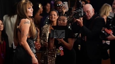 Miley Cyrus arrives at the 67th annual Grammy Awards. (Jordan Strauss/Invision/AP) Miley Cyrus arrives at the 67th annual Grammy Awards. (Jordan Strauss/Invision/AP)
