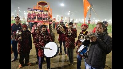 A band with a Muslim bandmaster leads a procession of an akhada for the Basant Panchami Snan, in Prayagraj on Monday. (Anil Kumar Maurya/HT) A band with a Muslim bandmaster leads a procession of an akhada for the Basant Panchami Snan, in Prayagraj on Monday. (Anil Kumar Maurya/HT)