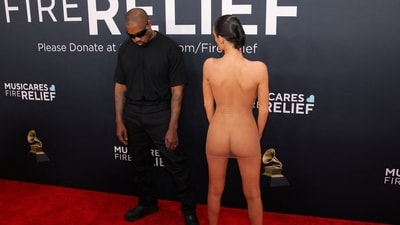 Kanye West and Bianca Censori pose at the red carpet. (REUTERS)