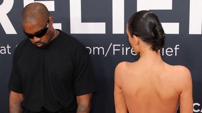 Kanye West and Bianca Censori pose at the red carpet. (REUTERS)