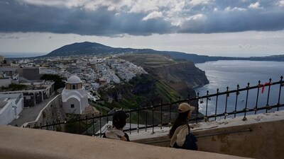 Tourists walk on the narrow streets of Fira town on the popular Aegean Sea holiday island of Santorini, southern Greece, Monday, Feb. 3, 2025, as emergency crews were deployed on the island after a spike in seismic activity raised concerns about a potentially powerful earthquake. (AP) Tourists walk on the narrow streets of Fira town on the popular Aegean Sea holiday island of Santorini, southern Greece, Monday, Feb. 3, 2025, as emergency crews were deployed on the island after a spike in seismic activity raised concerns about a potentially powerful earthquake. (AP)