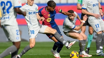 Barcelona's Spanish forward Lamine Yamal dribbling past Deportivo Alaves players at the Estadi Olimpic Lluis Companys. (AFP) Barcelona's Spanish forward Lamine Yamal dribbling past Deportivo Alaves players at the Estadi Olimpic Lluis Companys. (AFP)
