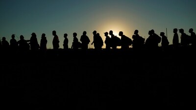 FILE - Migrants who crossed the Rio Grande and entered the U.S. from Mexico are lined up for processing by U.S. Customs and Border Protection, Sept. 23, 2023, in Eagle Pass, Texas. (AP) FILE - Migrants who crossed the Rio Grande and entered the U.S. from Mexico are lined up for processing by U.S. Customs and Border Protection, Sept. 23, 2023, in Eagle Pass, Texas. (AP)