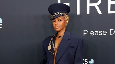 Janelle Monáe's 2025 Grammys look was a showstopper! She stepped away from her signature black-and-white palette and opted for a navy Fall 2024 suit from AREA, complete with intricate gold and sapphire stone detailing. (AFP) Janelle Monáe's 2025 Grammys look was a showstopper! She stepped away from her signature black-and-white palette and opted for a navy Fall 2024 suit from AREA, complete with intricate gold and sapphire stone detailing. (AFP)