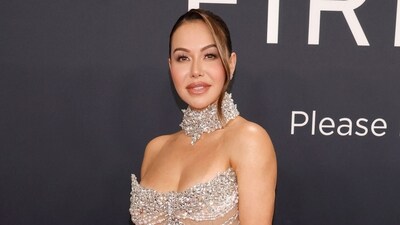 Chiquis Rivera stunned at the 2025 Grammy with diamonds that wrap up around the singer's neck and match her dazzling gown. (AFP) Chiquis Rivera stunned at the 2025 Grammy with diamonds that wrap up around the singer's neck and match her dazzling gown. (AFP)