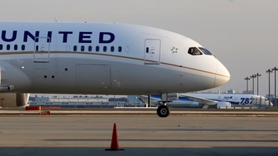 FILE PHOTO: A United Airlines' Boeing Co's 787 Dreamliner plane (front) taxis after landing following its flight from Los Angeles, in front of an All Nippon Airways' (ANA) Boeing Co's 787 Dreamliner plane waiting for checks at New Tokyo international airport in Narita, east of Tokyo January 17, 2013. REUTERS/Toru Hanai/File Photo (REUTERS)