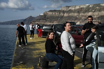Motorists and travellers wait on the quayside for the arrival of the ferry at the port on the Greek Island of Santorini on February 3, 2025, as they prepare to leave in the wake of recurring earthquakes. Fresh overnight tremors shook Greece's top tourist island Santorini, media reports said, prompting people to sleep outdoors and others to leave by plane or ferry. (AFP) Motorists and travellers wait on the quayside for the arrival of the ferry at the port on the Greek Island of Santorini on February 3, 2025, as they prepare to leave in the wake of recurring earthquakes. Fresh overnight tremors shook Greece's top tourist island Santorini, media reports said, prompting people to sleep outdoors and others to leave by plane or ferry. (AFP)