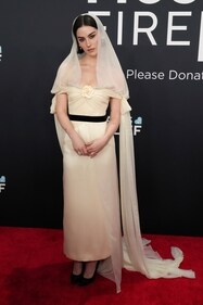Gracie Abrams in a built-in veil dress