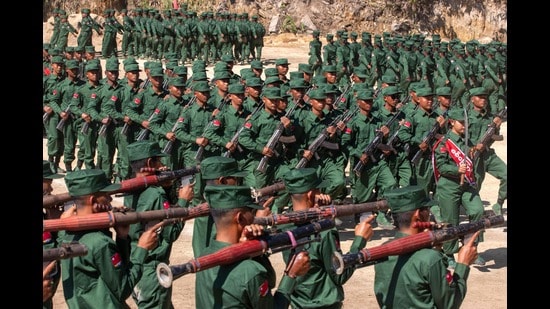 (FILES) This photo taken on December 28, 2024 shows members of the Mandalay People's Defense Forces (MDY-PDF) marching in a graduation ceremony after training at a camp in an undisclosed location in Myanmar's northern Shan State. (Photo by AFP) (AFP)