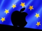 A 3D printed Apple logo is seen in front of a displayed European Union flag in this illustration taken September 2, 2016.