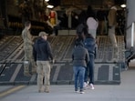 This image released by the Department of Defense shows US Customs and Border Protection security agents guide a group of undocumented migrants onboard a C-17 Globemaster III aircraft assigned to the 60th Air Mobility Wing for a removal flight at Fort Bliss, Texas, on January 23, 2025. This image released by the Department of Defense shows US Customs and Border Protection security agents guide a group of undocumented migrants onboard a C-17 Globemaster III aircraft assigned to the 60th Air Mobility Wing for a removal flight at Fort Bliss, Texas, on January 23, 2025.