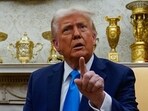 U.S. President Donald Trump gestures as he speaks during a meeting at the White House in Washington, US.