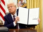 US President Donald Trump holds a signed executive order on AI, in the Oval Office of the White House, in Washington. (File image)