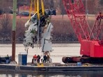 A large portion of the damaged plane fuselage is lifted from the Potomac River during recovery efforts after the American Airlines crash on February 03, 2025 in Arlington, Virginia (Photo by CHIP SOMODEVILLA / GETTY IMAGES NORTH AMERICA / Getty Images via AFP) A large portion of the damaged plane fuselage is lifted from the Potomac River during recovery efforts after the American Airlines crash on February 03, 2025 in Arlington, Virginia (Photo by CHIP SOMODEVILLA / GETTY IMAGES NORTH AMERICA / Getty Images via AFP)