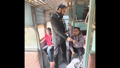 An official checking the ticket of a passenger in a train at Ludhiana railway station on Tuesday. (HT Photo) An official checking the ticket of a passenger in a train at Ludhiana railway station on Tuesday. (HT Photo)
