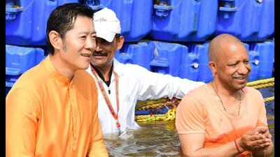 Bhutan King Jigme Khesar Namgyel Wangchuck, along with Uttar Pradesh CM Yogi Adityanath, taking a dip at the sacred Triveni Sangam in Prayagraj on February 4. (HT photo)