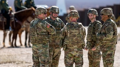 Army soldiers chat while waiting the arrival of Defense Secretary Pete Hegseth to the US-Mexico border in Sunland Park, N.M., Monday, Feb. 3, 2025. (AP Photo/Andres Leighton) (AP) Army soldiers chat while waiting the arrival of Defense Secretary Pete Hegseth to the US-Mexico border in Sunland Park, N.M., Monday, Feb. 3, 2025. (AP Photo/Andres Leighton) (AP)
