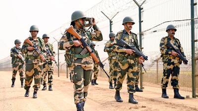 Border Security Force personnel keep vigil along the India-Bangladesh Border near Atila BOP in South Dinajpur. (ANI)