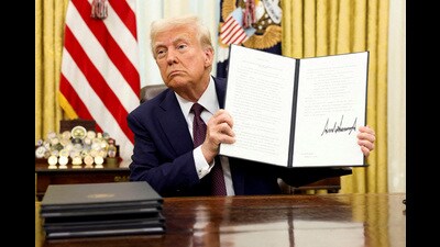 FILE PHOTO: U.S. President Donald Trump holds a signed executive order on AI, in the Oval Office of the White House, in Washington, U.S., January 23, 2025./File Photo/File Photo (REUTERS)