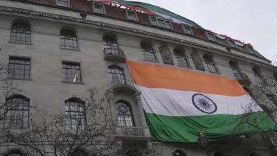 People show an Indian flag from the roof of the Indian High Commission as protestors of the Khalistan movement demonstrate on the streets in London on March 22, 2022. (AP File Photo) People show an Indian flag from the roof of the Indian High Commission as protestors of the Khalistan movement demonstrate on the streets in London on March 22, 2022. (AP File Photo)