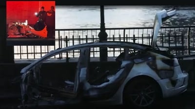 A female driver was killed after a Tesla flipped and caught flames in Manhattan on early Tuesday morning. (New York Post) A female driver was killed after a Tesla flipped and caught flames in Manhattan on early Tuesday morning. (New York Post)