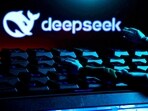 The DeepSeek logo, a keyboard, and robot hands are seen in this illustration taken January 27, 2025.