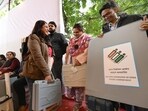 Polling Parties collect Electronic Voting Machines (EVM) and other election materials at a distribution center on the eve of the Delhi Assembly elections at Gole Market in New Delhi on Tuesday. Polling Parties collect Electronic Voting Machines (EVM) and other election materials at a distribution center on the eve of the Delhi Assembly elections at Gole Market in New Delhi on Tuesday.