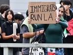 A person holds a sign as hundreds of high school students participate in a protest entitled "A Day Without Immigrants" through downtown Los Angeles on February 4, 2025, against stepped-up federal enforcement against illegal immigration. A person holds a sign as hundreds of high school students participate in a protest entitled "A Day Without Immigrants" through downtown Los Angeles on February 4, 2025, against stepped-up federal enforcement against illegal immigration.